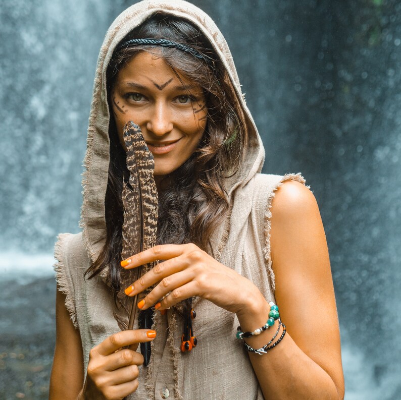 This grey hoodie jacket is a perfect blend of bohemian charm and shamanic essence, designed for those who appreciate the freedom of movement and the allure of tribal aesthetics.