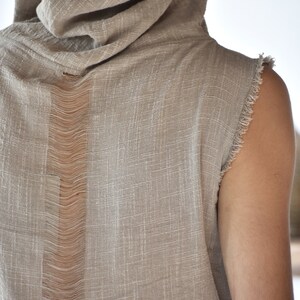 This grey hoodie jacket is a perfect blend of bohemian charm and shamanic essence, designed for those who appreciate the freedom of movement and the allure of tribal aesthetics.