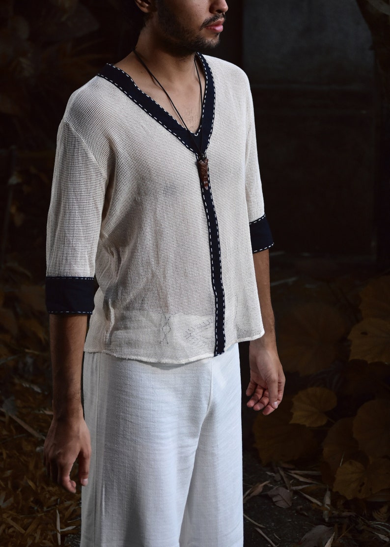 Made from 100% eco-friendly cotton and featuring open-mesh fabric, this shaman shirt ensures breathability and comfort in any setting, from bustling festivals to tranquil daily life.