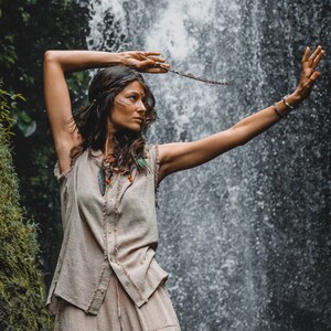 This grey hoodie jacket is a perfect blend of bohemian charm and shamanic essence, designed for those who appreciate the freedom of movement and the allure of tribal aesthetics.