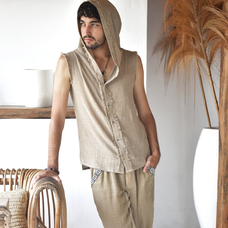 This grey hoodie jacket is a perfect blend of bohemian charm and shamanic essence, designed for those who appreciate the freedom of movement and the allure of tribal aesthetics.