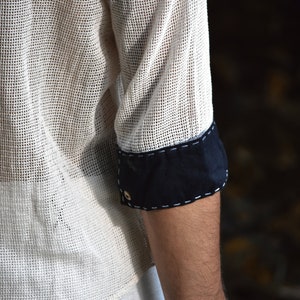 Made from 100% eco-friendly cotton and featuring open-mesh fabric, this shaman shirt ensures breathability and comfort in any setting, from bustling festivals to tranquil daily life.