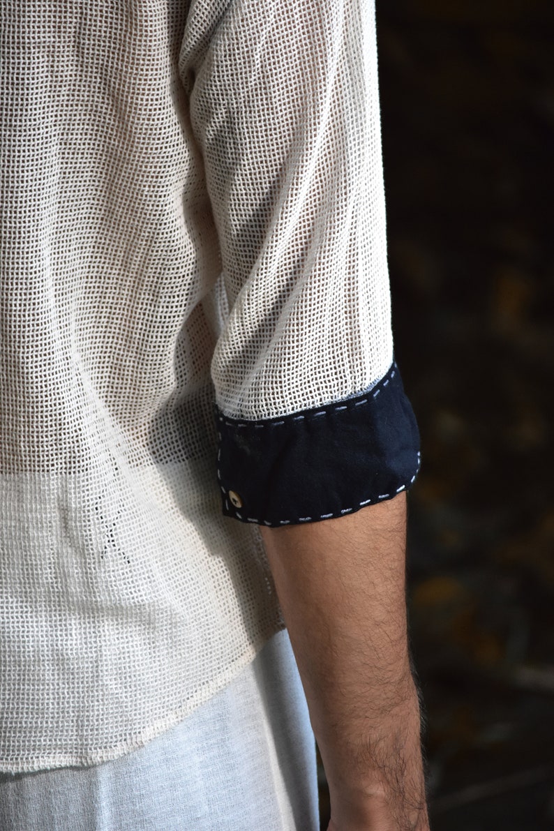 Made from 100% eco-friendly cotton and featuring open-mesh fabric, this shaman shirt ensures breathability and comfort in any setting, from bustling festivals to tranquil daily life.