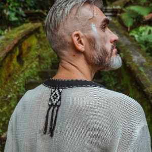 Made from 100% eco-friendly cotton and featuring open-mesh fabric, this shaman shirt ensures breathability and comfort in any setting, from bustling festivals to tranquil daily life.