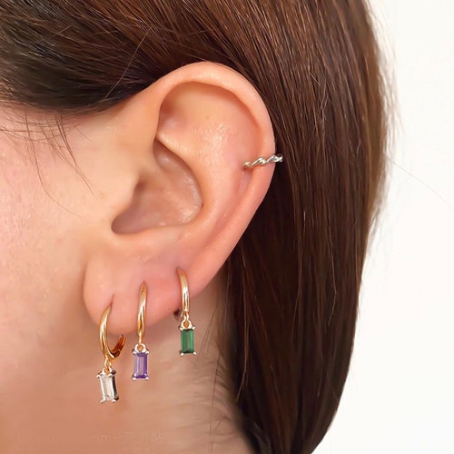 Colourful crystal pendents on beautifully smooth 10mm hoops. Selection of five rainbow colours, great to mix and match. Sold individually.