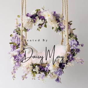May include: A floral swing with a white cushion, adorned with purple and white flowers, and suspended by rope. The text "Created By Daisy May" is written on the image.