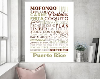 May include: A white poster with a list of Puerto Rican food names in brown and olive green text. The words include "Mofongo", "Pasteles", "Carne", "Coquito", and "Puerto Rico" at the bottom.