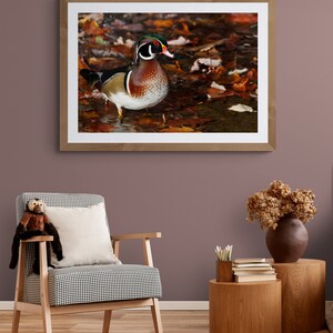 May include: A framed photograph of a wood duck standing in a bed of fallen autumn leaves. The duck has a colorful plumage of green, brown, and white. The leaves are shades of orange, red, and yellow.