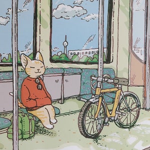 May include: A colorful illustration of a train car interior with a cat sitting on a seat, a person holding a plant, and a dog standing near a bicycle. The text "Illustration by RYOKO NACARA" is visible on the ceiling of the train car.