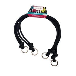 May include: Black double-rolled microfiber handle ties with silver metal rings. The ties are knotted and attached to the rings. The product packaging is visible at the top, with text that reads "everything Abby".