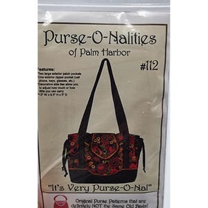 May include: A package for a purse pattern, featuring a floral print tote bag with black handles. The text reads "Purse-O-Nalities of Palm Harbor" and "It's Very Purse-O-Nal". The bag measures 13" W x 9.5" H x 5" D.