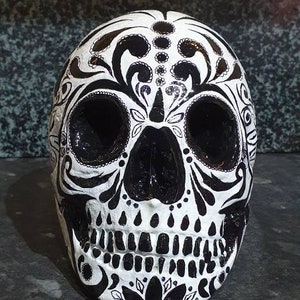 Black & White sugar candy skull. Hand cast and painted in day of the dead design. Ornament, cosplay, halloween, prop, bookend