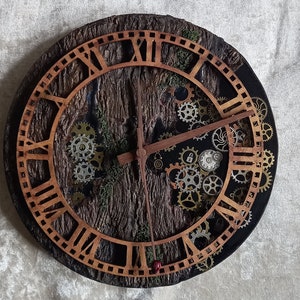 May include: A round, wooden clock with Roman numerals and a black background. The clock face is decorated with gears and a wood grain texture.
