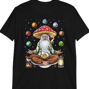 May include: A black t-shirt with a graphic of a cartoon character sitting on a mushroom. The character is wearing a white beard, a green robe, and a red hat. The character is surrounded by colorful planets.