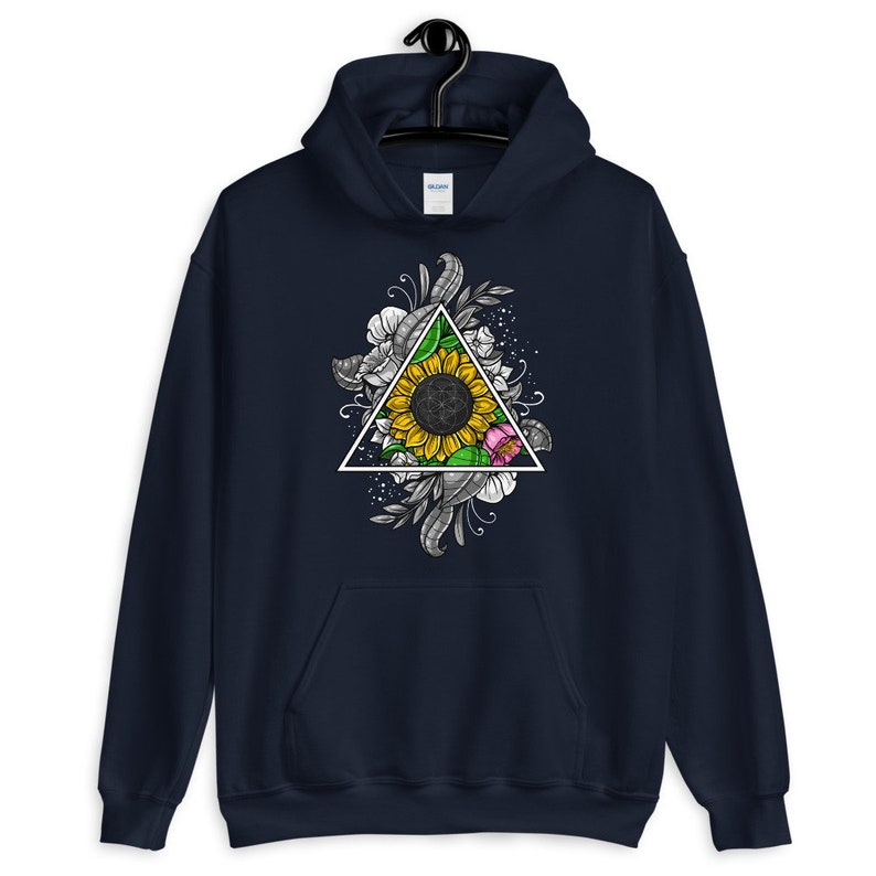 May include: A navy blue hoodie with a graphic of a sunflower inside a triangle surrounded by floral designs.