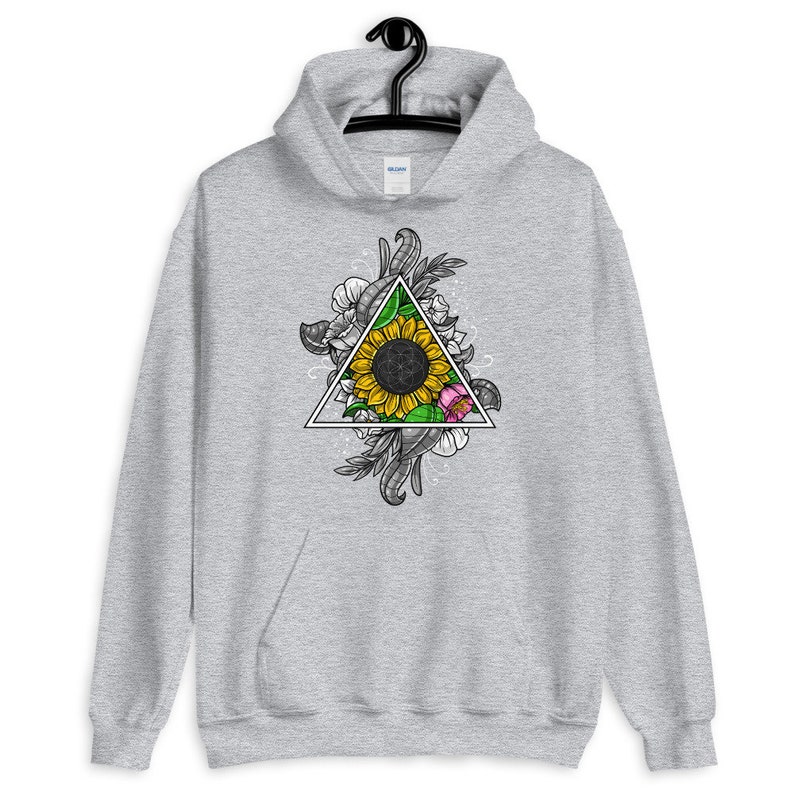 May include: A gray hoodie with a graphic print of a sunflower inside a triangle surrounded by floral designs.