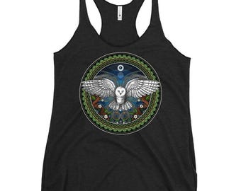 May include: A black tank top featuring a white owl flying within a green, blue and gold mandala design.
