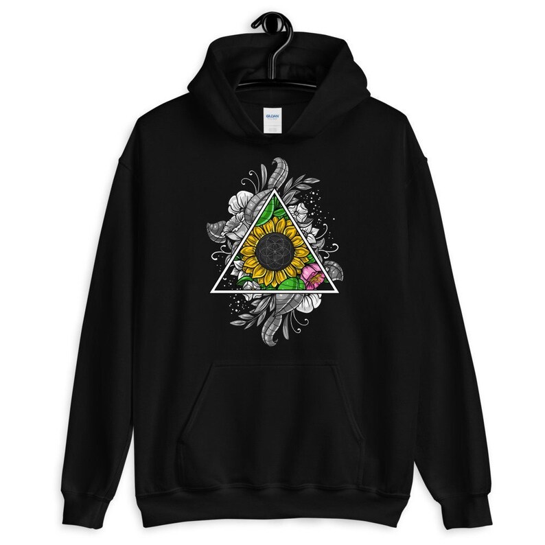 May include: Black hoodie with a graphic of a sunflower inside a triangle surrounded by floral designs.