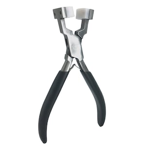 May include: A pair of silver-toned pliers with black rubber handles. The pliers have white plastic jaws for crimping.