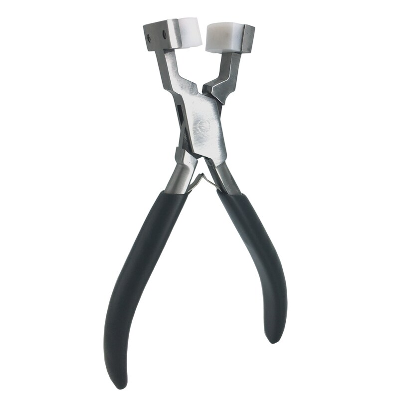 May include: A pair of silver-toned pliers with black rubber handles. The pliers have white plastic jaws for crimping.