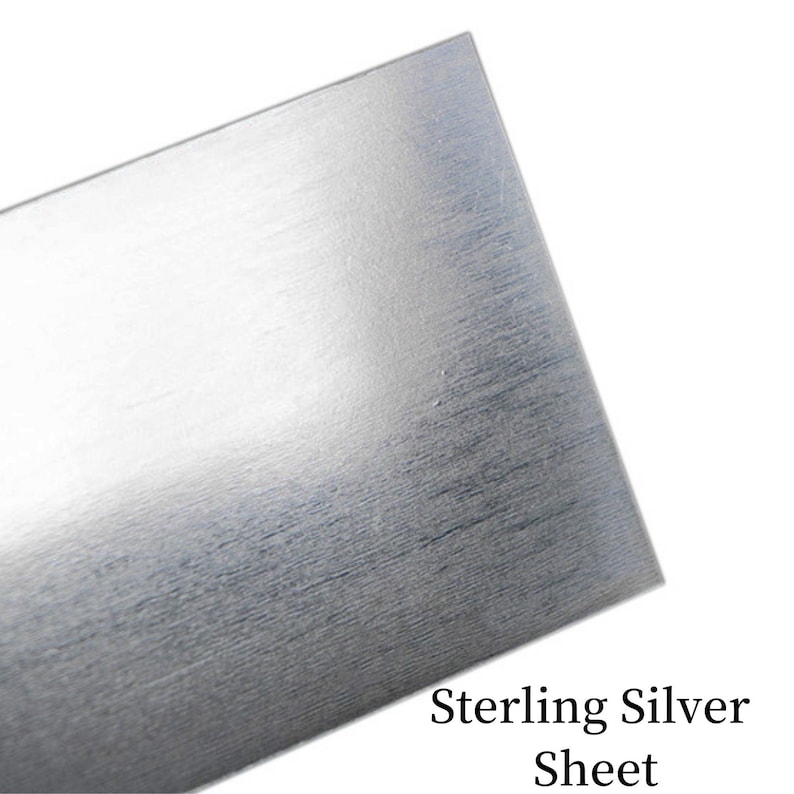 May include: A sheet of sterling silver metal. The sheet has a brushed finish.