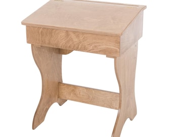 May include: A light-colored wooden writing desk with a slanted top and a small storage compartment. The desk has curved legs and a horizontal support beam. The desk is made of light-colored wood.
