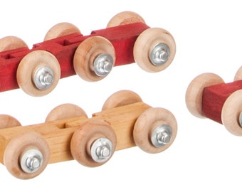 May include: Three wooden toy cars with red and natural wood bodies and wooden wheels. The cars have metal axles and nuts.