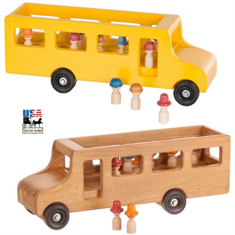 May include: Two wooden toy school buses, one yellow and one natural wood, with small wooden figures with hats. The figures can be placed inside the buses or outside.  The buses have wheels and are made in the USA.