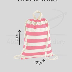 May include: A pink and white striped drawstring backpack. The bag is 14.5 inches wide and 18 inches tall. The bag has a white drawstring closure and a white handle. The word "DIMENSIONS" is printed at the top.