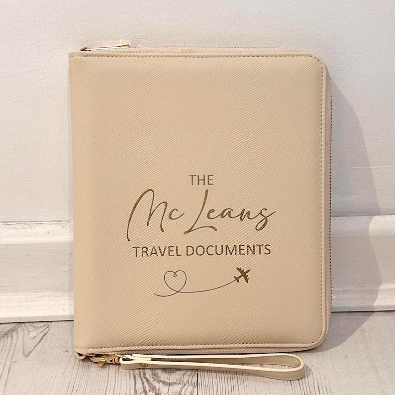 oyster passport travel case printed with gold personalisation.