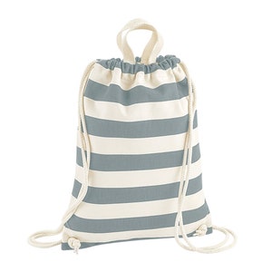 May include: A drawstring backpack with alternating horizontal stripes of light blue and off-white. The bag has a matching light blue drawstring closure and a loop handle at the top. The bag is made of a soft, durable fabric.