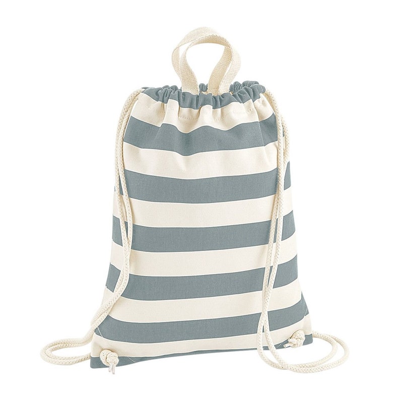 May include: A drawstring backpack with alternating horizontal stripes of light blue and off-white. The bag has a matching light blue drawstring closure and a loop handle at the top. The bag is made of a soft, durable fabric.