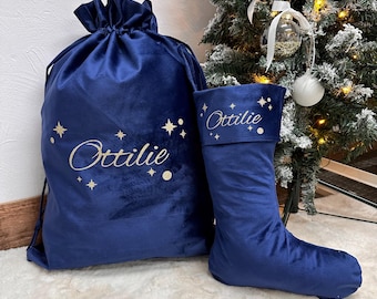 May include: A blue velvet Christmas stocking and a matching Santa sack with gold stars and the name "Ottilie" embroidered on them.