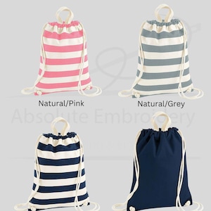 May include: Four drawstring backpacks in various colors. The bags are shown in pink and white stripes, grey and white stripes, navy and white stripes, and solid navy. Each bag has a white drawstring and a loop handle at the top. The text "Item Colour" is at the top.