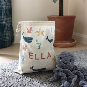 Children's personalised toy bag, drawstring bag, choice of patterns and colours, dinosaur, storage, tidy, play, unisex, baby, toddler, cute