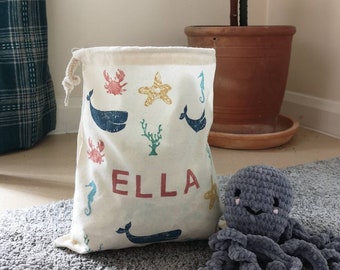 Children's personalised toy bag, drawstring bag, choice of patterns and colours, dinosaur, storage, tidy, play, unisex, baby, toddler, cute