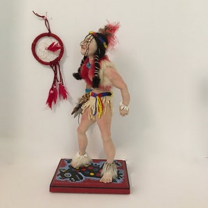 Indian Brave doing the Ghost Dance in preparation for battle.