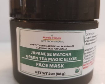 May include: A black jar with a green and white label that reads "Japanese Matcha Green Tea Magic Elixir Face Mask". The label also says "Aurelia Natural Let's Grow Organic" and "Net Wt 2 oz (56g)".