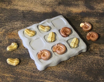 Ammonite and trilobite fossil Tic-Tac-Toe board