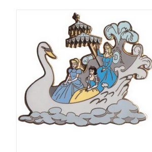 May include: A gold-tone pin featuring three Disney princesses riding in a white swan boat. The princesses are wearing blue and yellow dresses. The boat is decorated with a gold-tone canopy and a blue and white wave design.