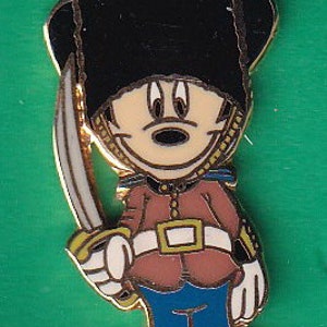 May include: A cartoon Mickey Mouse dressed as a British guard. He is wearing a red and gold uniform, a black hat with a red plume, and holding a sword.