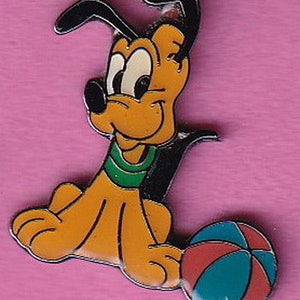 May include: A cartoon dog with brown fur, black ears, and a green collar is sitting with a red, blue, and white beach ball.