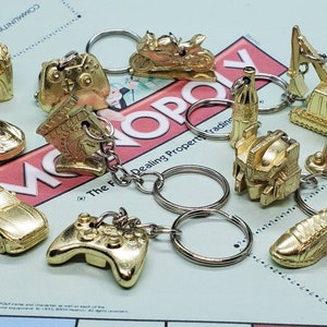 Monopoly Empire Edition Upcycled Metal Game Token Keychains Sports Car Fries Transformers Motorcycle Running Shoe Game Controller Soda