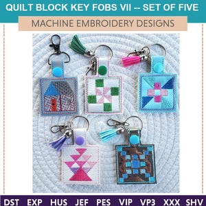 May include: Five machine embroidery designs for quilt block key fobs. The designs include a house, a pinwheel, a plus sign, a basket, and a checkerboard pattern. Each design is on a separate key fob with a silver key ring and a colorful tassel.