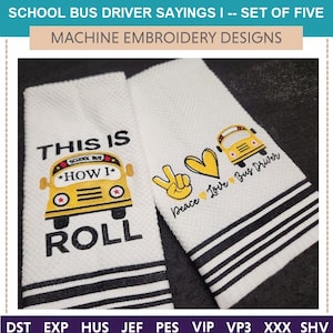 May include: Two white embroidered towels with black stripes and school bus designs. One towel reads "THIS IS HOW I ROLL" with a yellow school bus graphic. The other says "Peace Love Bus Driver" with a peace sign and heart.