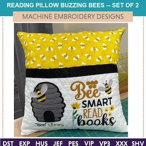 May include: A white pillow with a pocket on the front. The pocket has a beehive, a bee, and the text "Bee Smart Read Books" embroidered on it. The pillow is decorated with a yellow fabric with a pattern of bees.