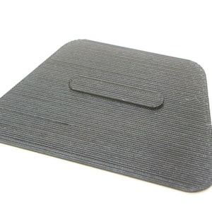 May include: A black, textured, triangular-shaped plastic piece with a rectangular cutout in the center.
