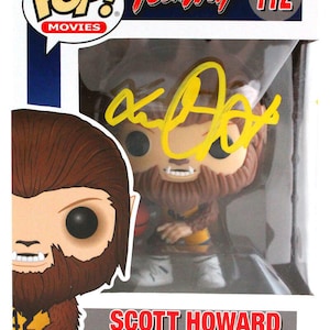 May include: A Pop! Movies vinyl figure of Scott Howard as the Teen Wolf from the movie Teen Wolf. The figure is wearing a yellow and black basketball jersey and holding a basketball. The figure is signed by the actor who played Scott Howard, Michael J. Fox.
