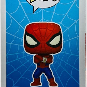May include: A red and blue Spider-Man Pop! Vinyl figure with a white background. The figure is standing with its arms crossed. The figure is numbered 932 and has the text "Spider-Man (Japanese TV Series)" below it.