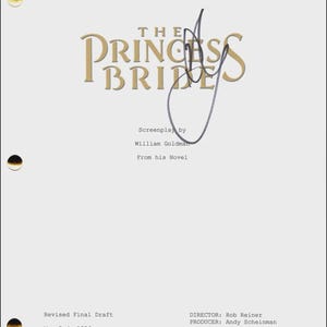 May include: A white document with the title "THE PRINCESS BRIDE" in gold lettering, with an autograph. The text includes "Screenplay by William Goldman" and "Revised Final Draft, May 3rd, 1986."